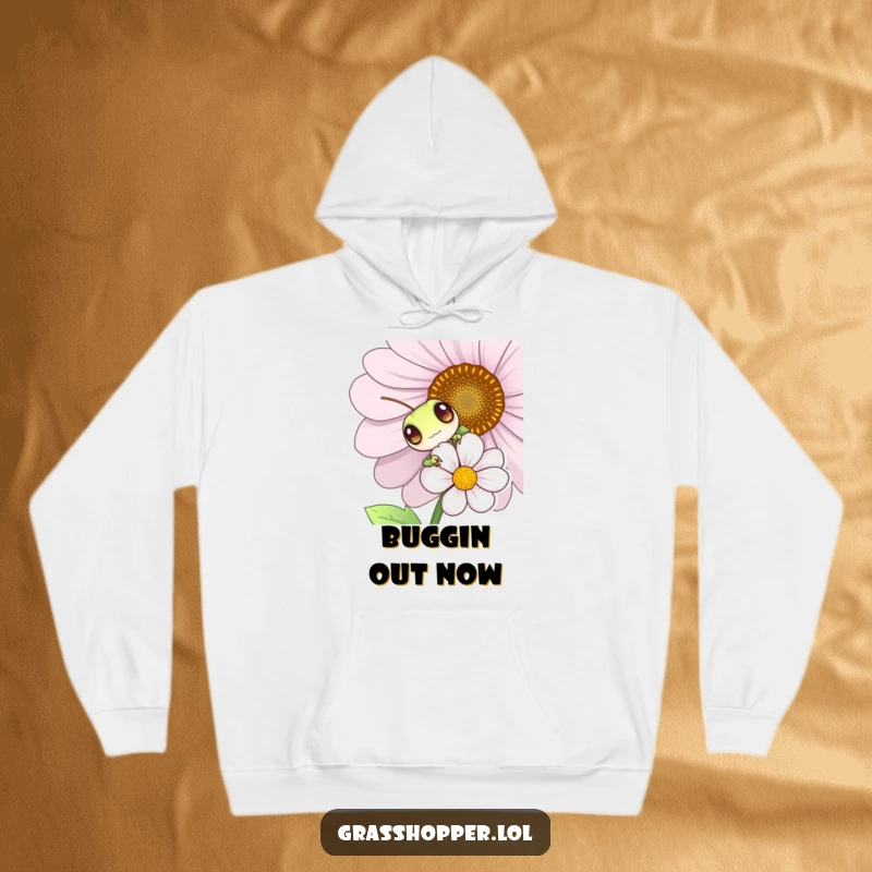 Funny grasshopper peeking from behind a flower, cozy hoodie, cute insect illustration, warm and playful apparel.
