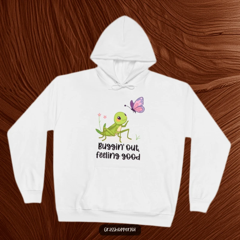 Funny hoodie illustrating a grasshopper playfully bopping a butterfly, creating a humorous and heartwarming scene for cozy wear.