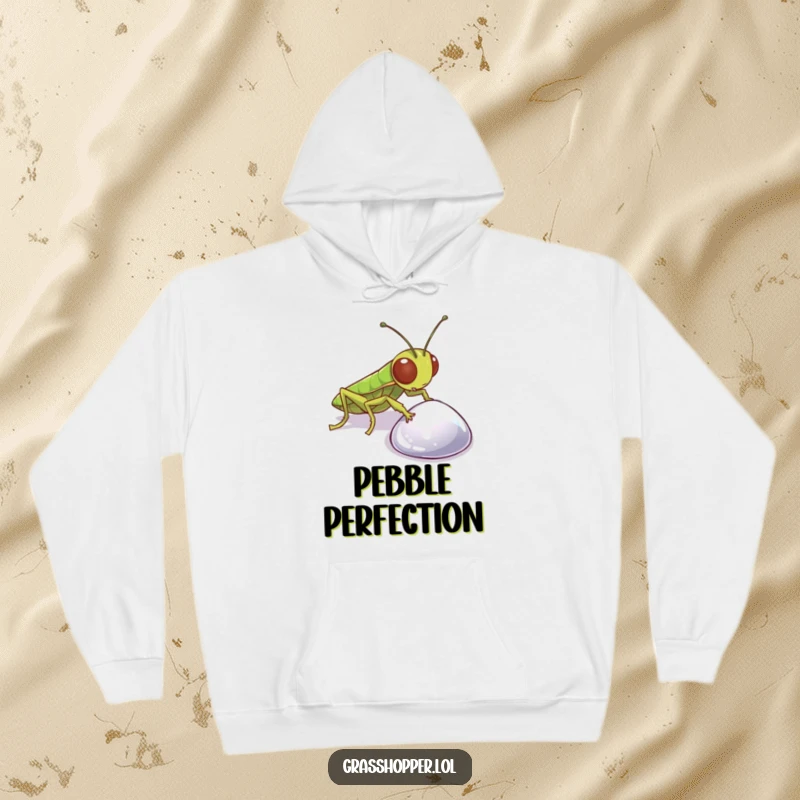 Funny Grasshopper Hoodie featuring a curious insect examining a sparkling pebble, perfect for cozy contemplation and lighthearted fun.