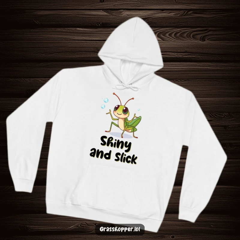 Funny grasshopper character cheerfully juggling dewdrops with its legs on this hoodie, a charming funny gift.