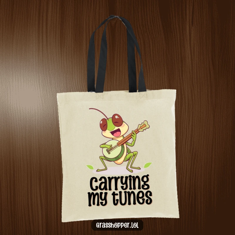 Funny grasshopper character excitedly playing a tiny leaf banjo on this tote bag, a musical funny gift.